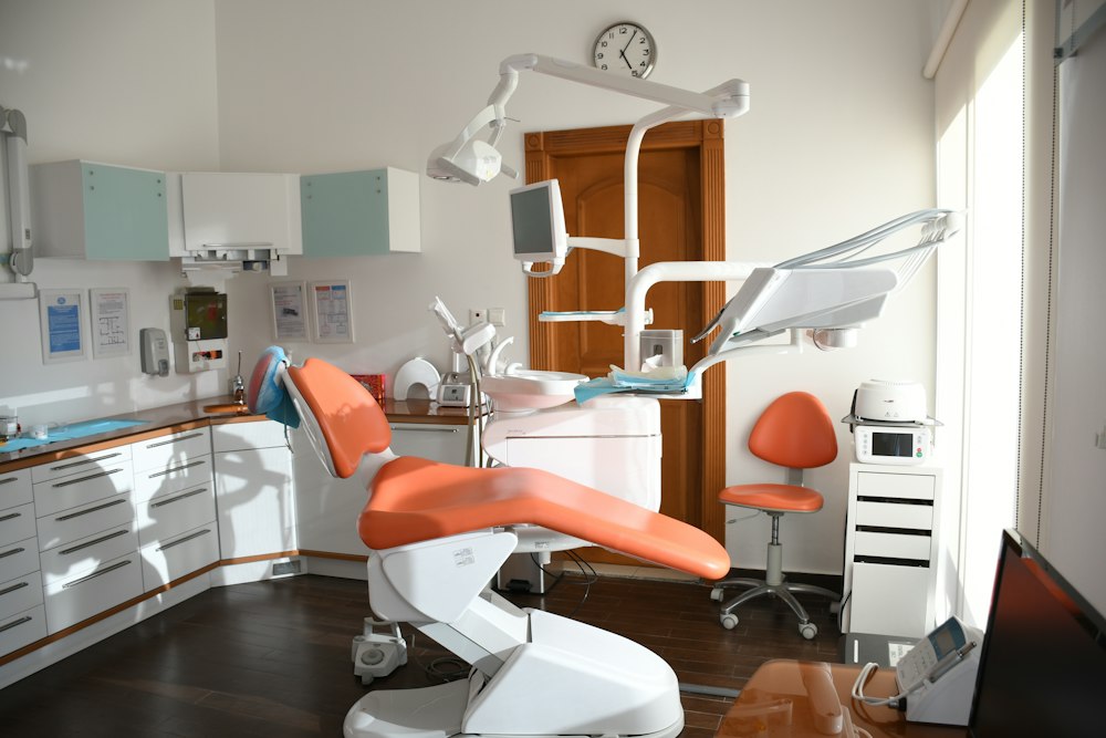 Dental chair and equipment in a warm sunlit room