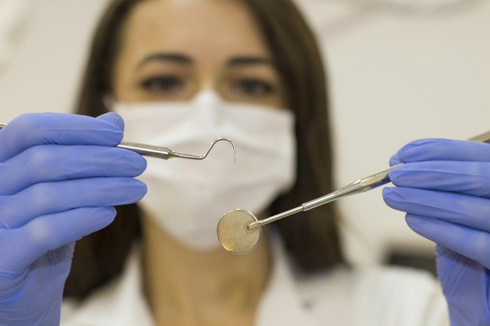 Dentist with mirror and probe